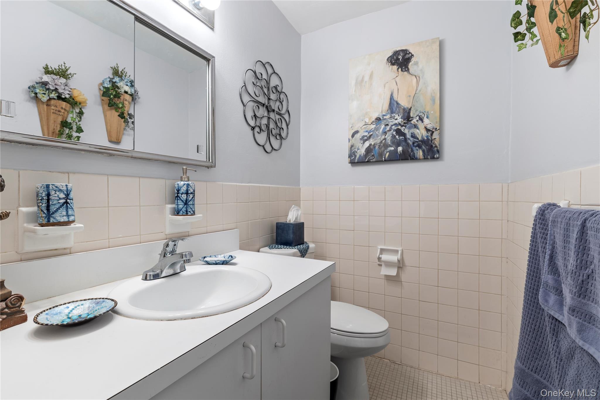 711 Shore Road, Unit 3B Long Beach, NY 11561 - Photo 12 of 20 Bathroom with tile walls, vanity, tile patterned flooring, and wainscoting