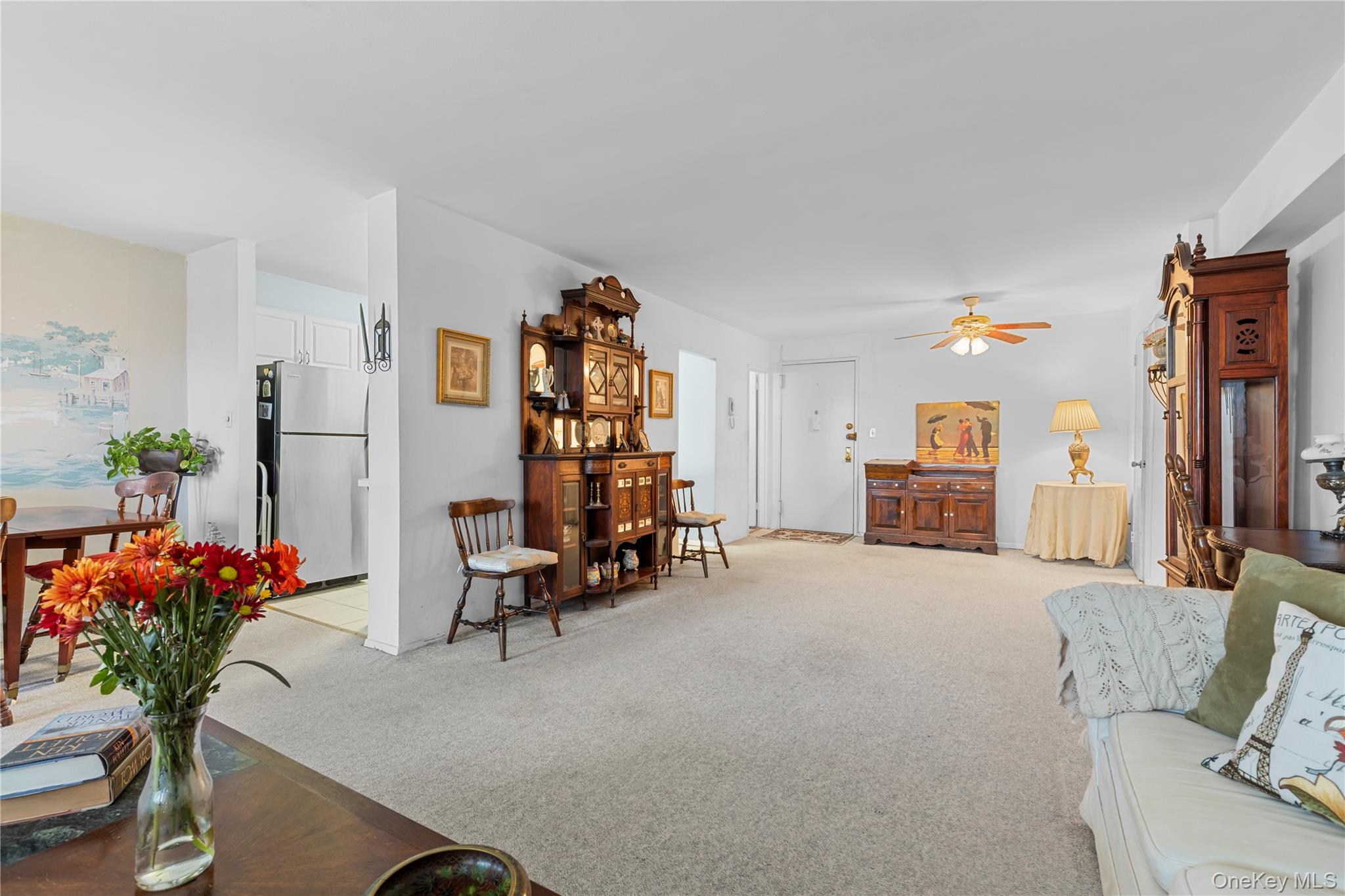 711 Shore Road, Unit 3B Long Beach, NY 11561 - Photo 3 of 20 Living room with light carpet and a ceiling fan