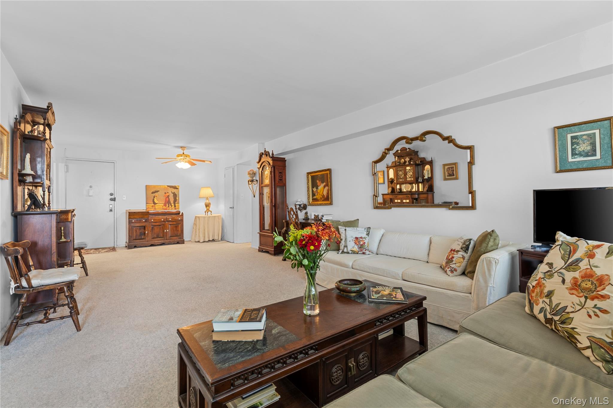 711 Shore Road, Unit 3B Long Beach, NY 11561 - Photo 4 of 20 Carpeted living area featuring a ceiling fan
