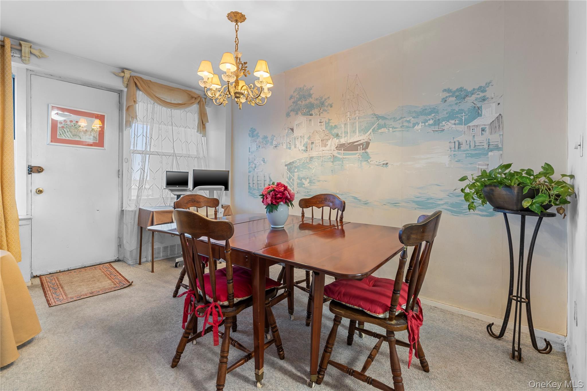 711 Shore Road, Unit 3B Long Beach, NY 11561 - Photo 5 of 20 Carpeted dining room with a chandelier