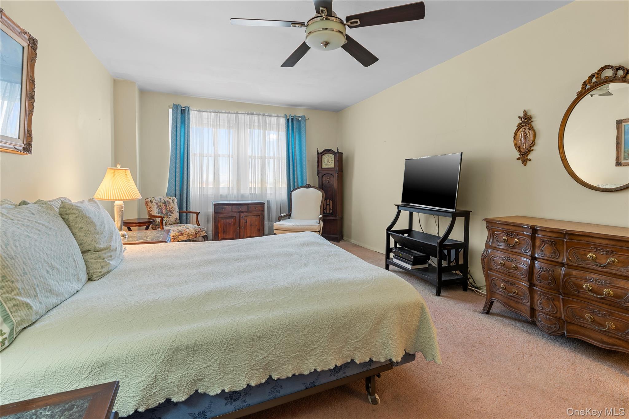 711 Shore Road, Unit 3B Long Beach, NY 11561 - Photo 9 of 20 Bedroom with light carpet and ceiling fan