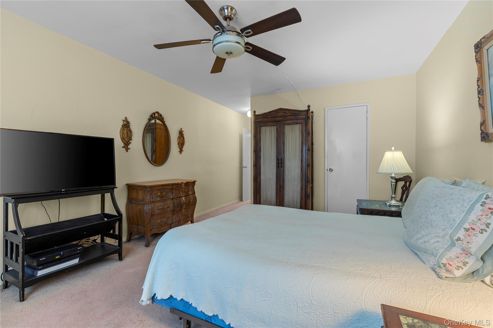 711 Shore Road, Unit 3B Long Beach, NY 11561 - Photo 10 of 20 Bedroom featuring light carpet and ceiling fan