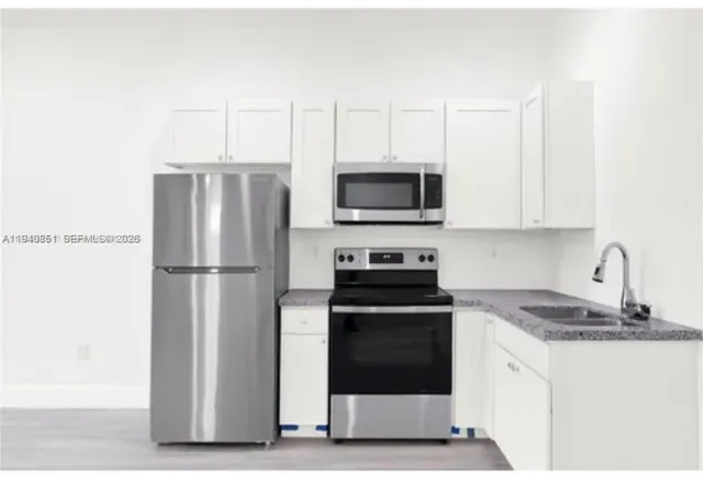 a bathroom with a sink toilet and bathtub