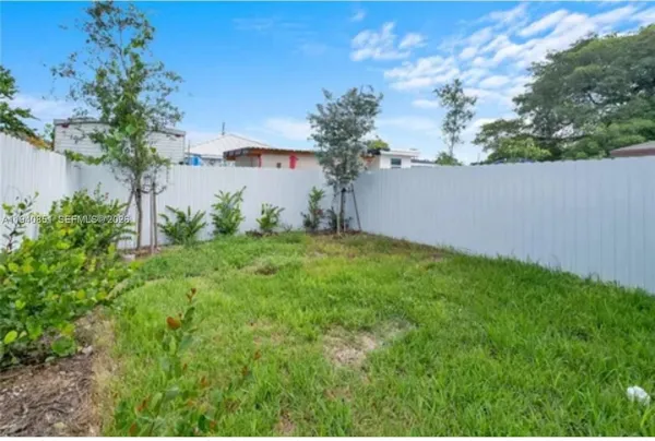 a view of a backyard with plants