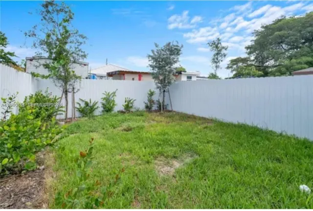a view of a backyard with plants