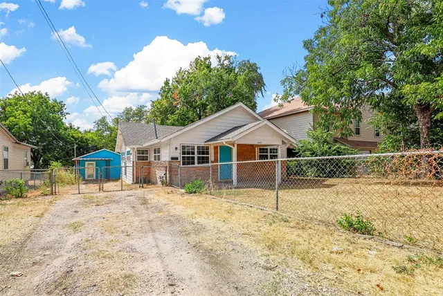 a house with trees in the background