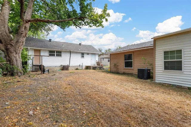 a house view with a backyard space