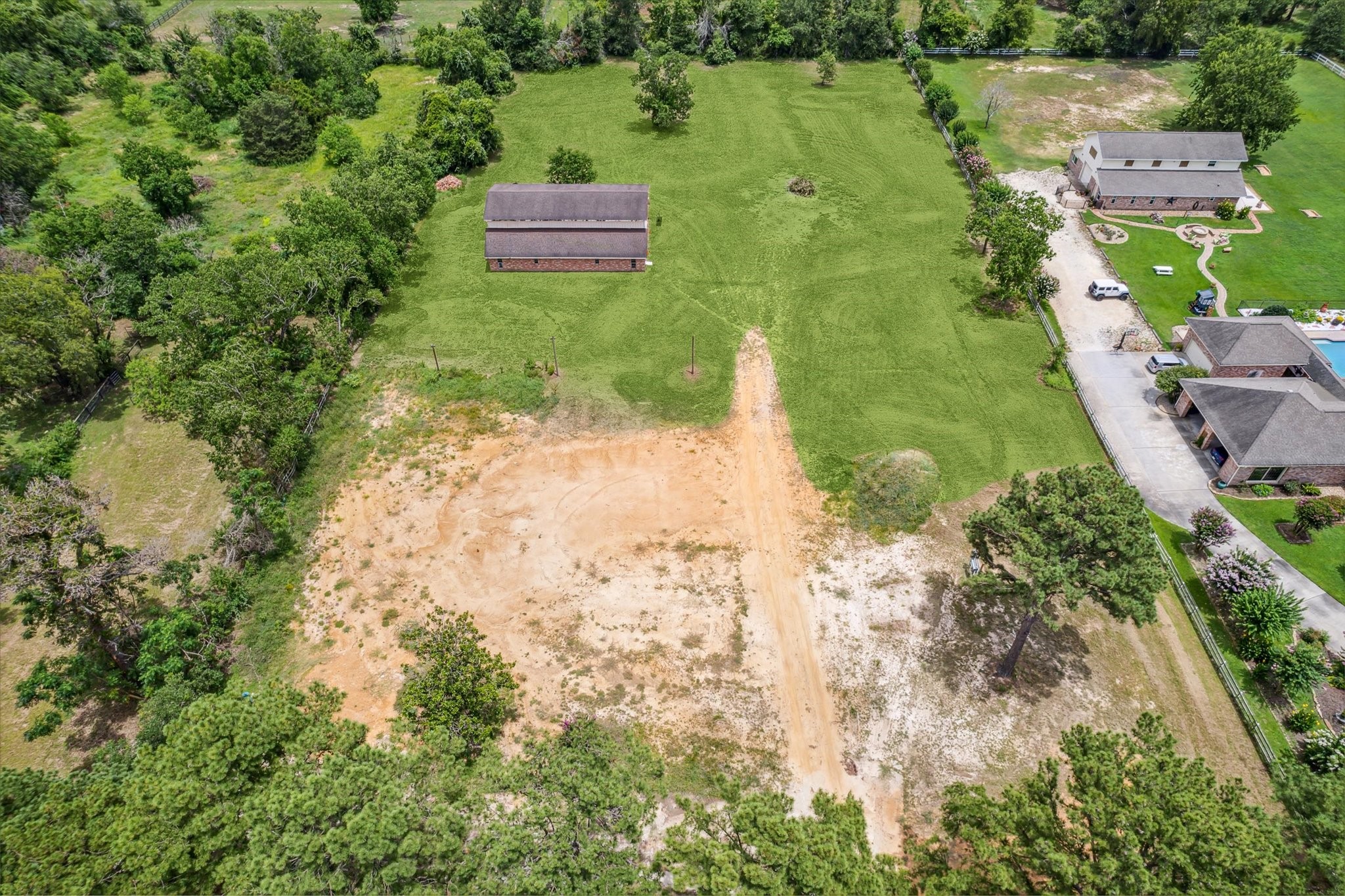 21402 Rosehill Church Road Tomball, TX 77377 - Photo 1 of 7 Aerial view of property showing the cleared homesite and 40'x60' barn in place.