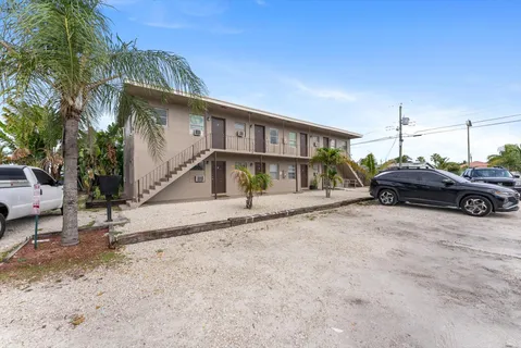 a view of a car park in front of house