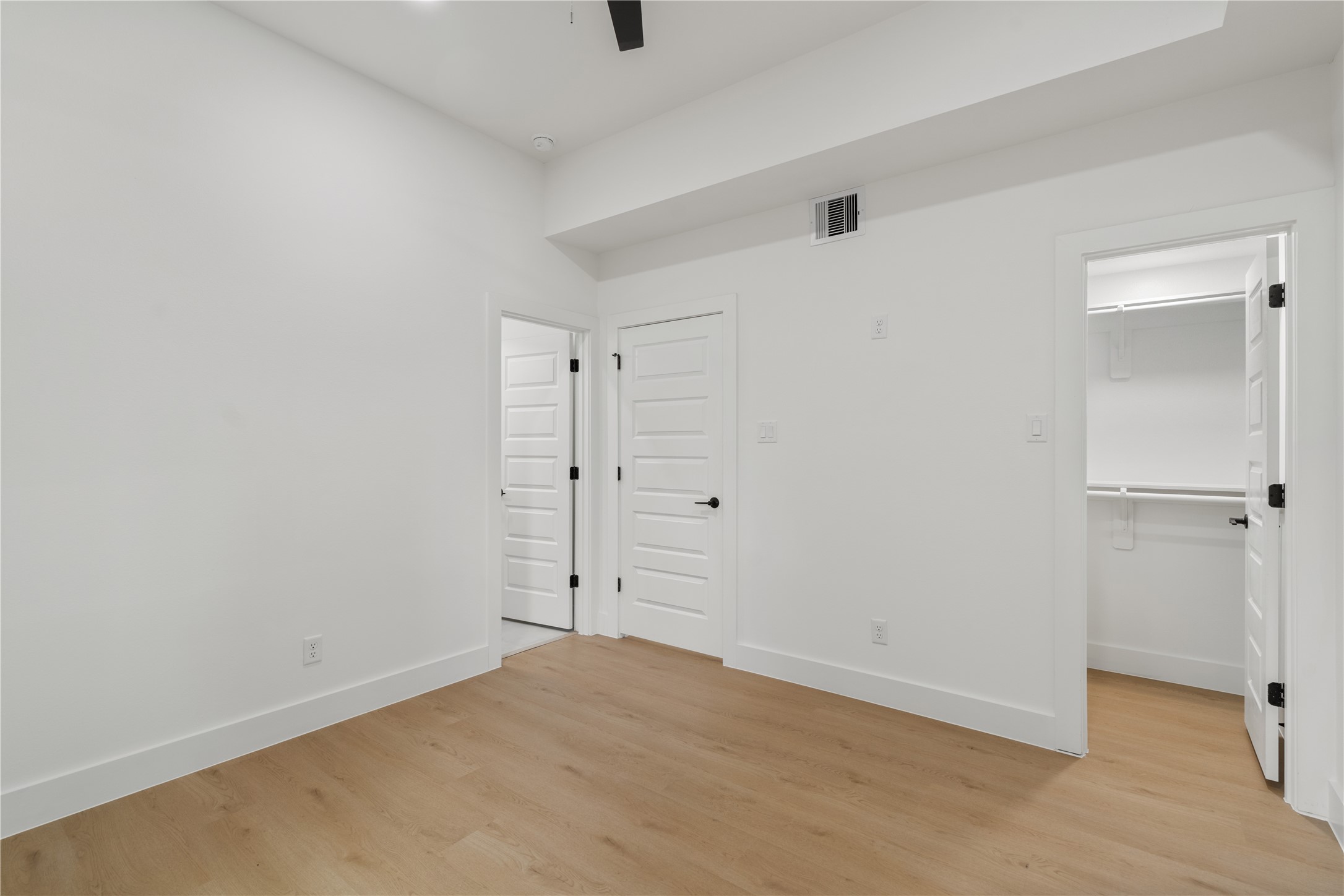 7319 Laura Koppe Road Houston, TX 77028 - Photo 35 of 42 Bright and spacious room with sleek hardwood floors, white walls, and modern doors leading to ample closet space.