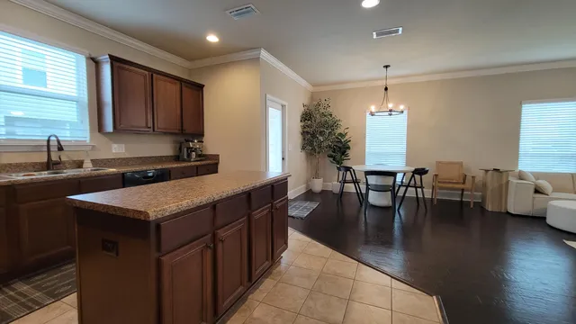 a kitchen with lots of counter top space and dining table