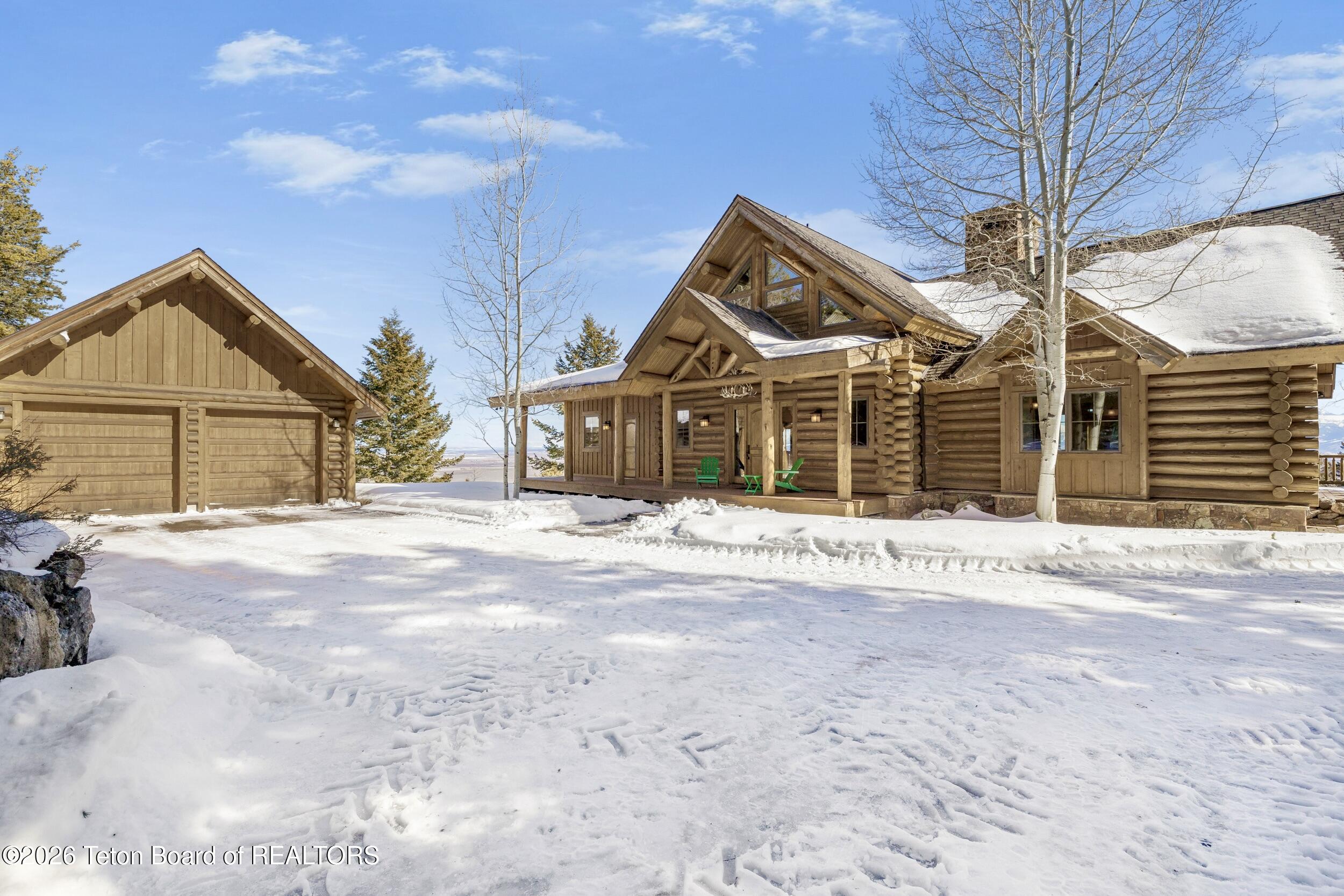 8157 Ripplinger Road Driggs, ID 83422 - Photo 44 of 48 Exterior Garage & Home