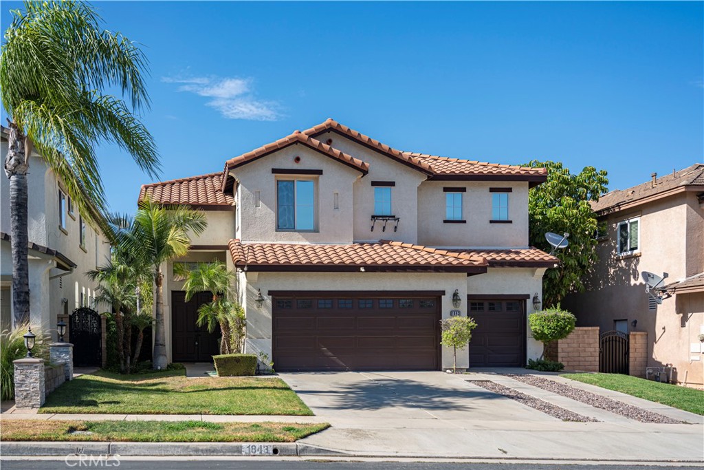 1843 Jupiter Hills Road Corona, CA 92883 - Photo 1 of 1 a front view of a house with a yard