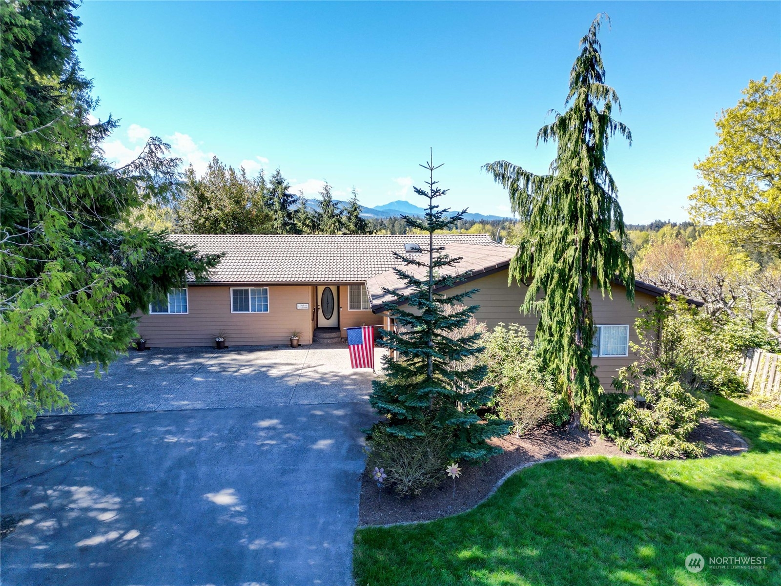 318 View Ridge Drive Port Angeles, WA 98362 - Photo 1 of 33 a front view of a house with a garden