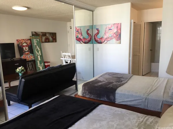 a bedroom with a bed and furniture