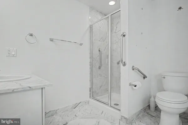 a view of a building with sitting area and furniture