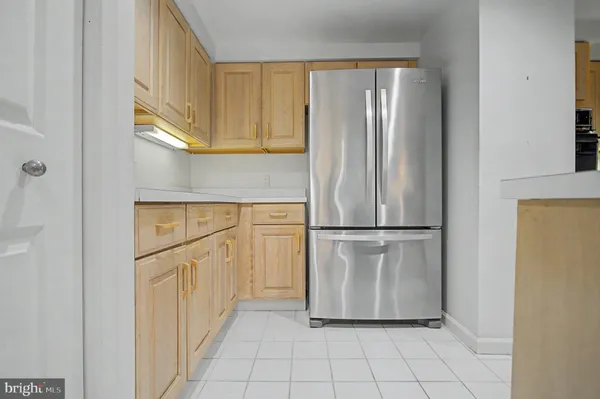 a living room with furniture and flowers