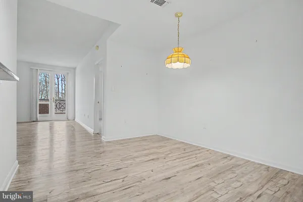a utility room with multiple dryer and washer