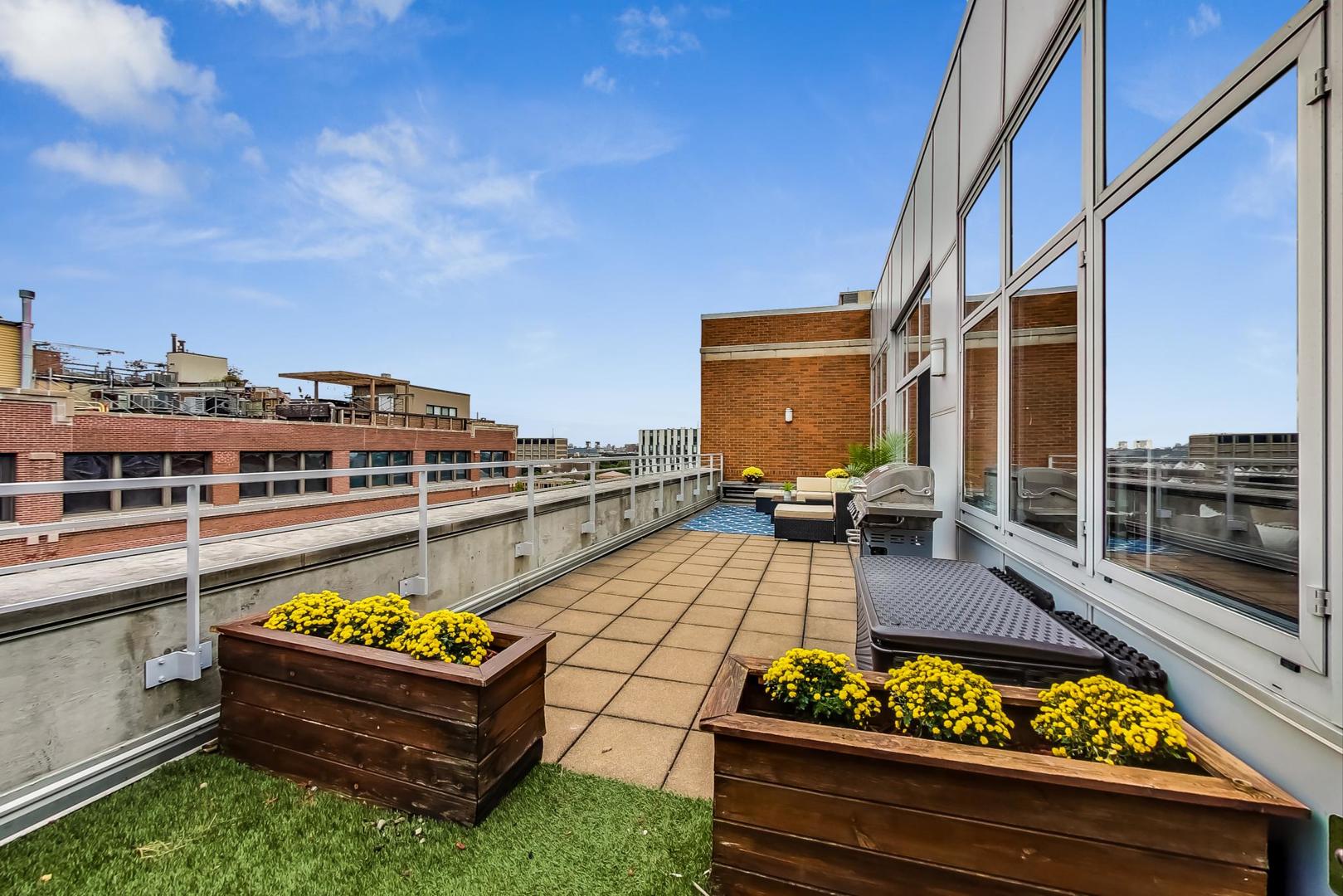 933 West Van Buren Street, Unit 903 Chicago, IL 60607 - Photo 12 of 50 a view of a balcony with chairs