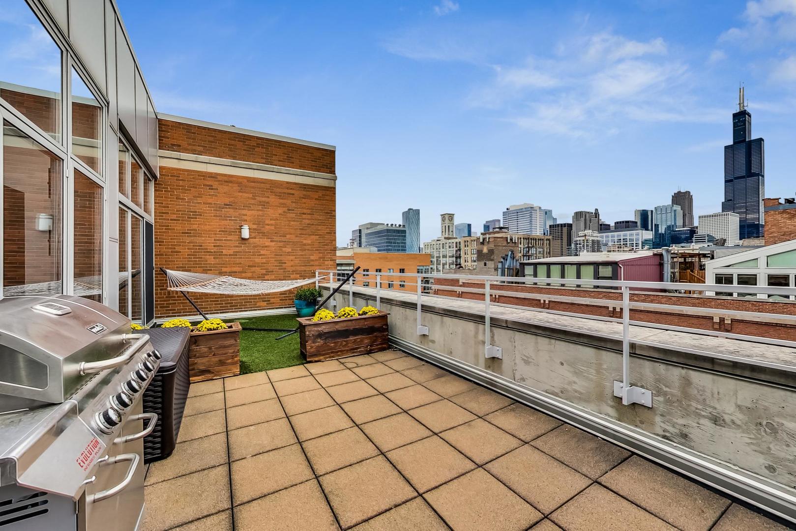 933 West Van Buren Street, Unit 903 Chicago, IL 60607 - Photo 14 of 50 a view of a terrace with seating area