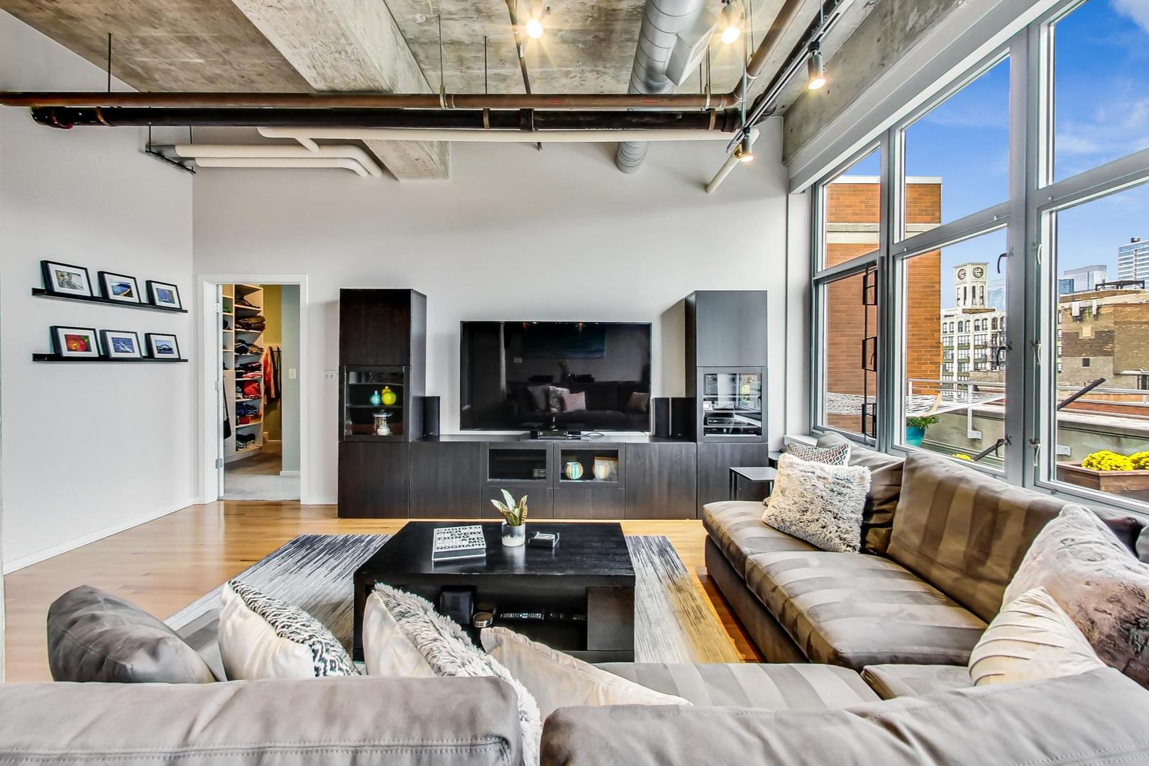 933 West Van Buren Street, Unit 903 Chicago, IL 60607 - Photo 6 of 50 a view of a livingroom with furniture and a large window