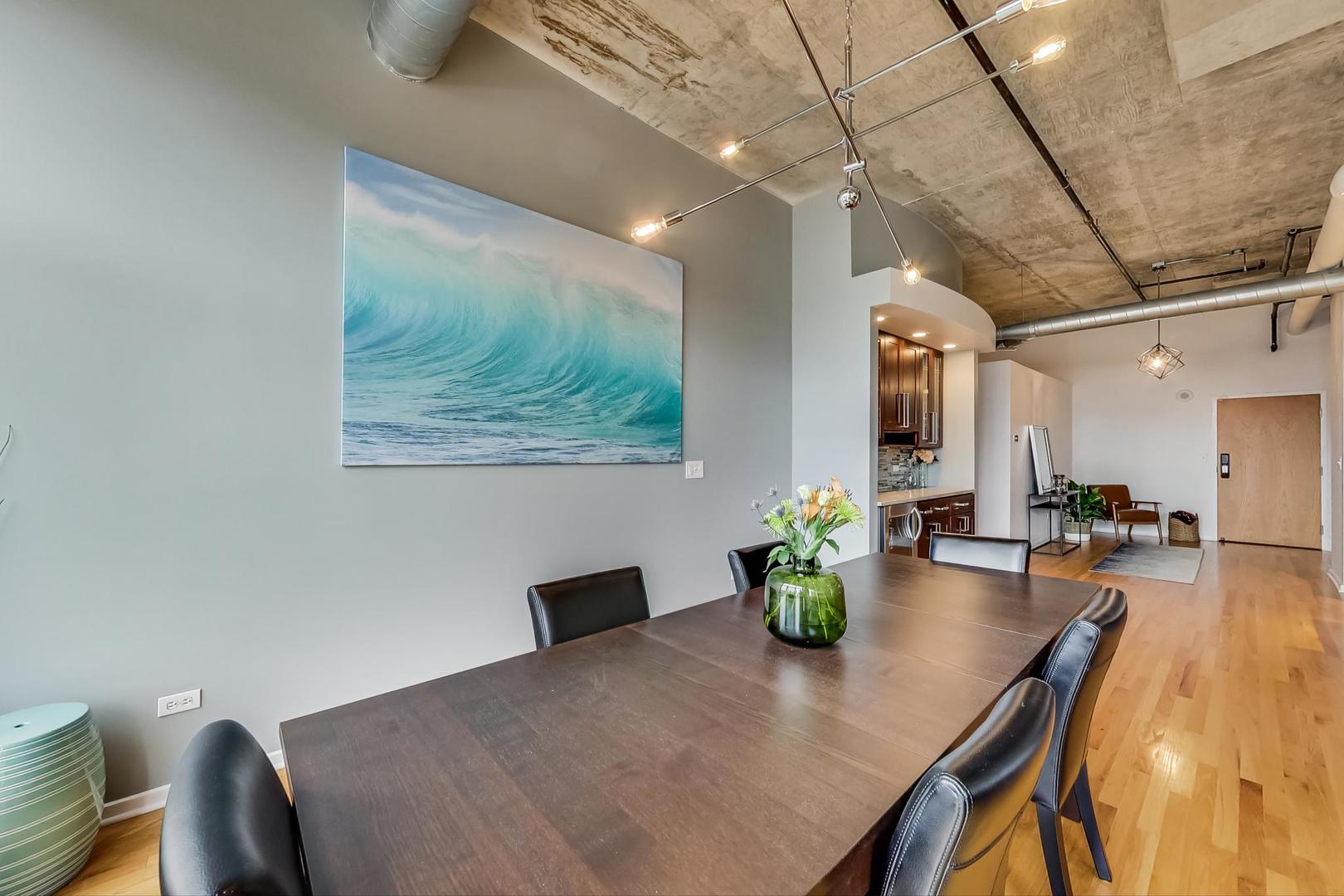933 West Van Buren Street, Unit 903 Chicago, IL 60607 - Photo 9 of 50 a view of a dining room with furniture