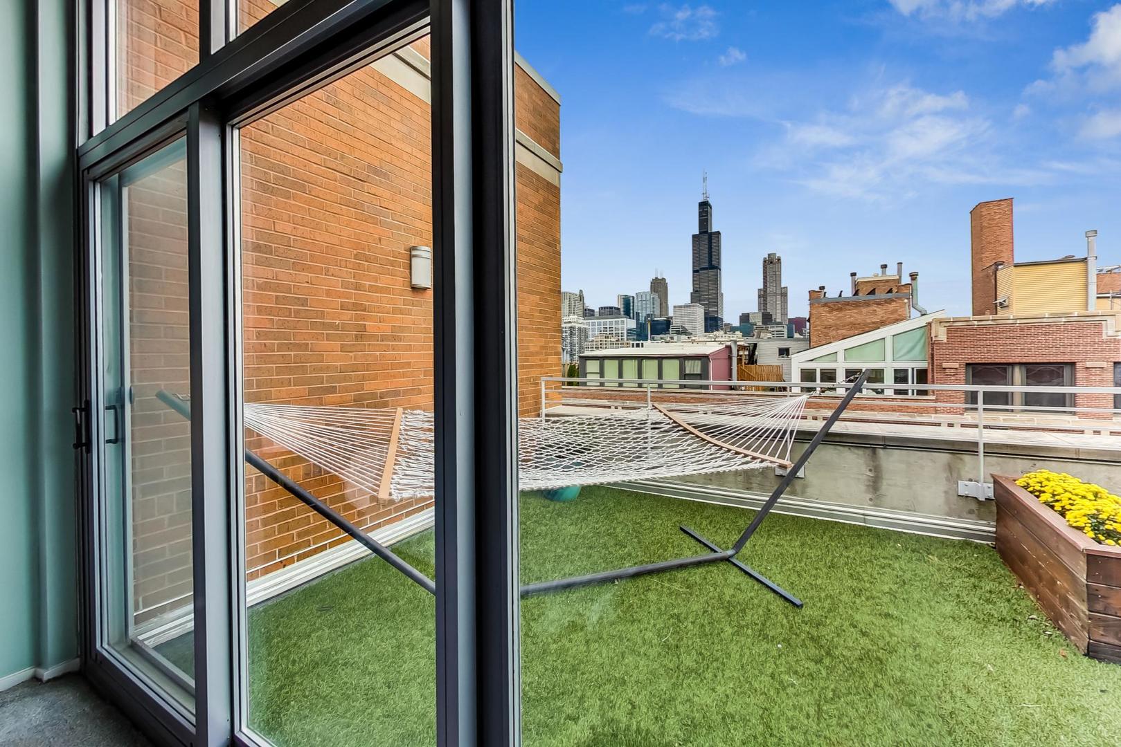 933 West Van Buren Street, Unit 903 Chicago, IL 60607 - Photo 10 of 50 a view of a swimming pool with outdoor seating