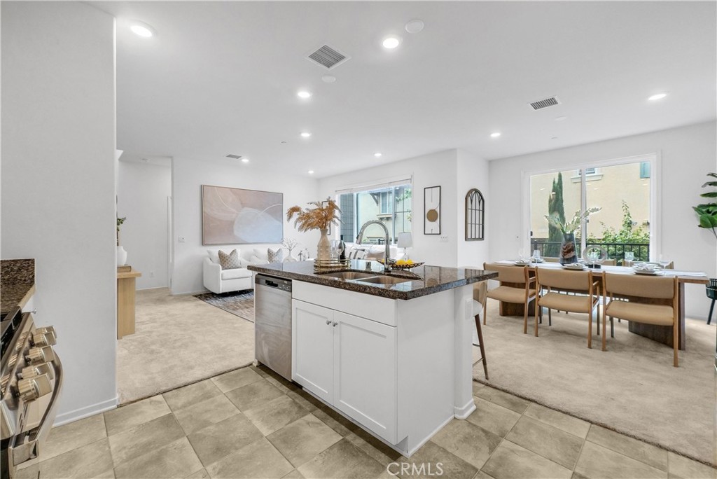 5584 Kate Way, Unit 10 Fontana, CA 92336 - Photo 8 of 42 a living room with furniture a window and a table