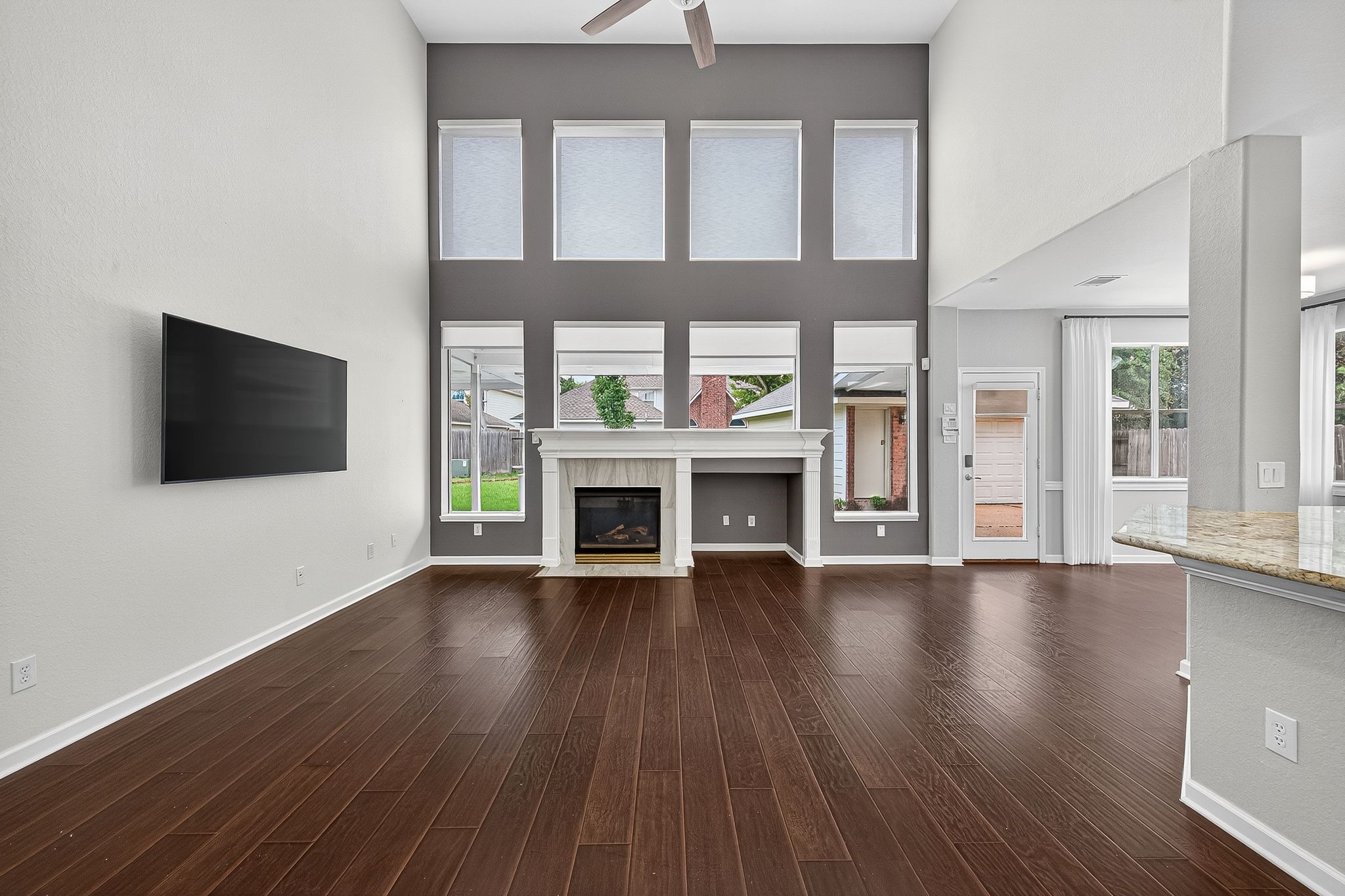 22406 Piper Terrace Lane Katy, TX 77450 - Photo 11 of 44 a view of an empty room with wooden floor and a window