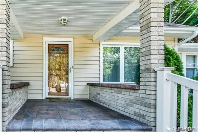 a living room with furniture a fireplace and flat screen tv