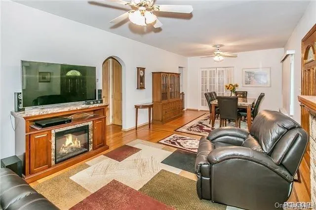 a dining room with furniture a rug and a chandelier