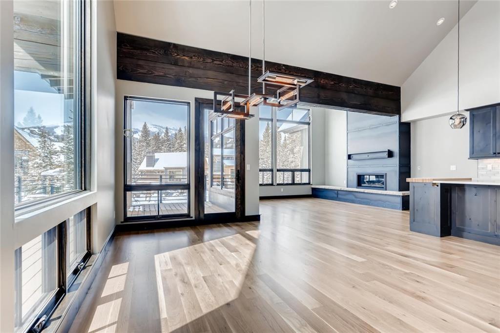 202 Cucumber Creek Road Breckenridge, CO 80424 - Photo 2 of 28 a view of a big room with wooden floor and windows
