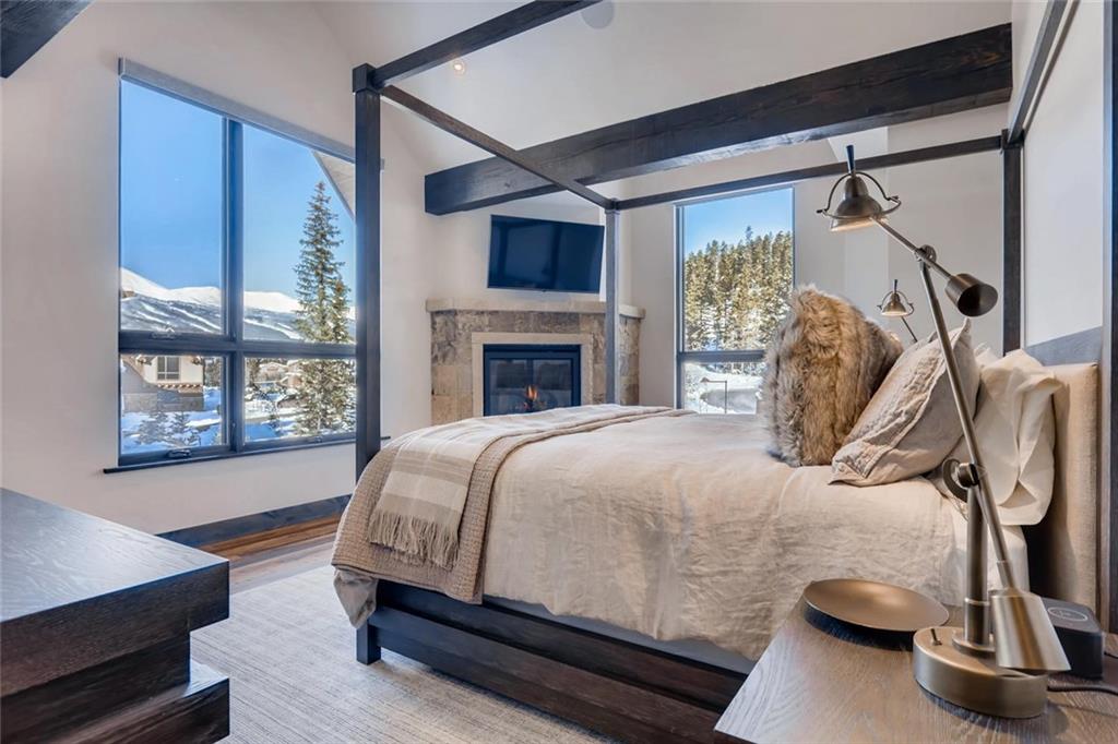 202 Cucumber Creek Road Breckenridge, CO 80424 - Photo 15 of 28 a bed sitting in a bedroom next to a window