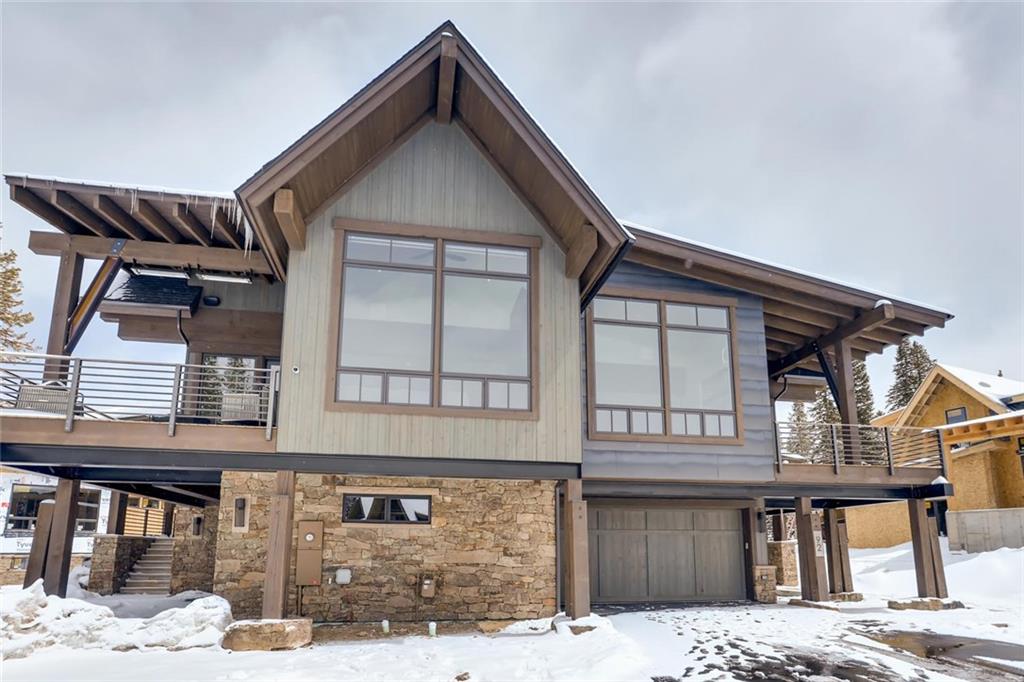 202 Cucumber Creek Road Breckenridge, CO 80424 - Photo 21 of 28 a front view of a house with a wooden fence