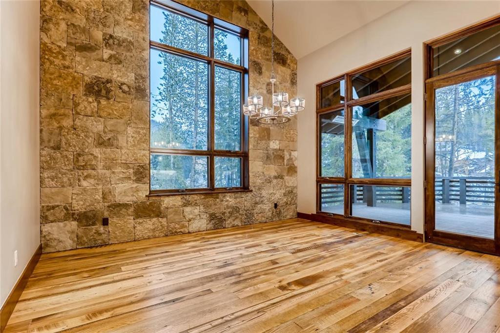 202 Cucumber Creek Road Breckenridge, CO 80424 - Photo 9 of 28 a view of a room with wooden floor and windows