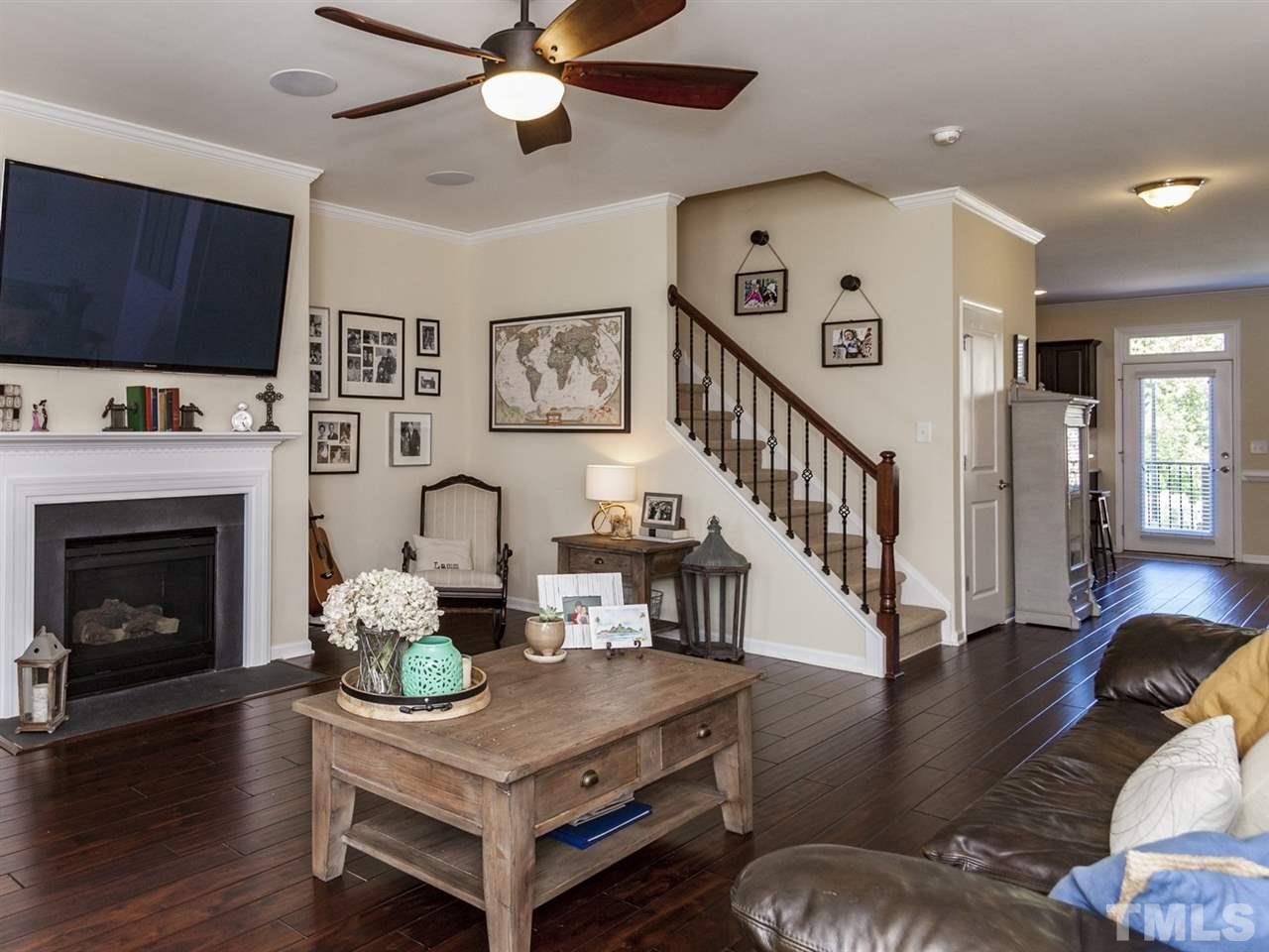 1310 Cornell Place Raleigh, NC 27607 - Photo 8 of 25 a living room with furniture and wooden floor