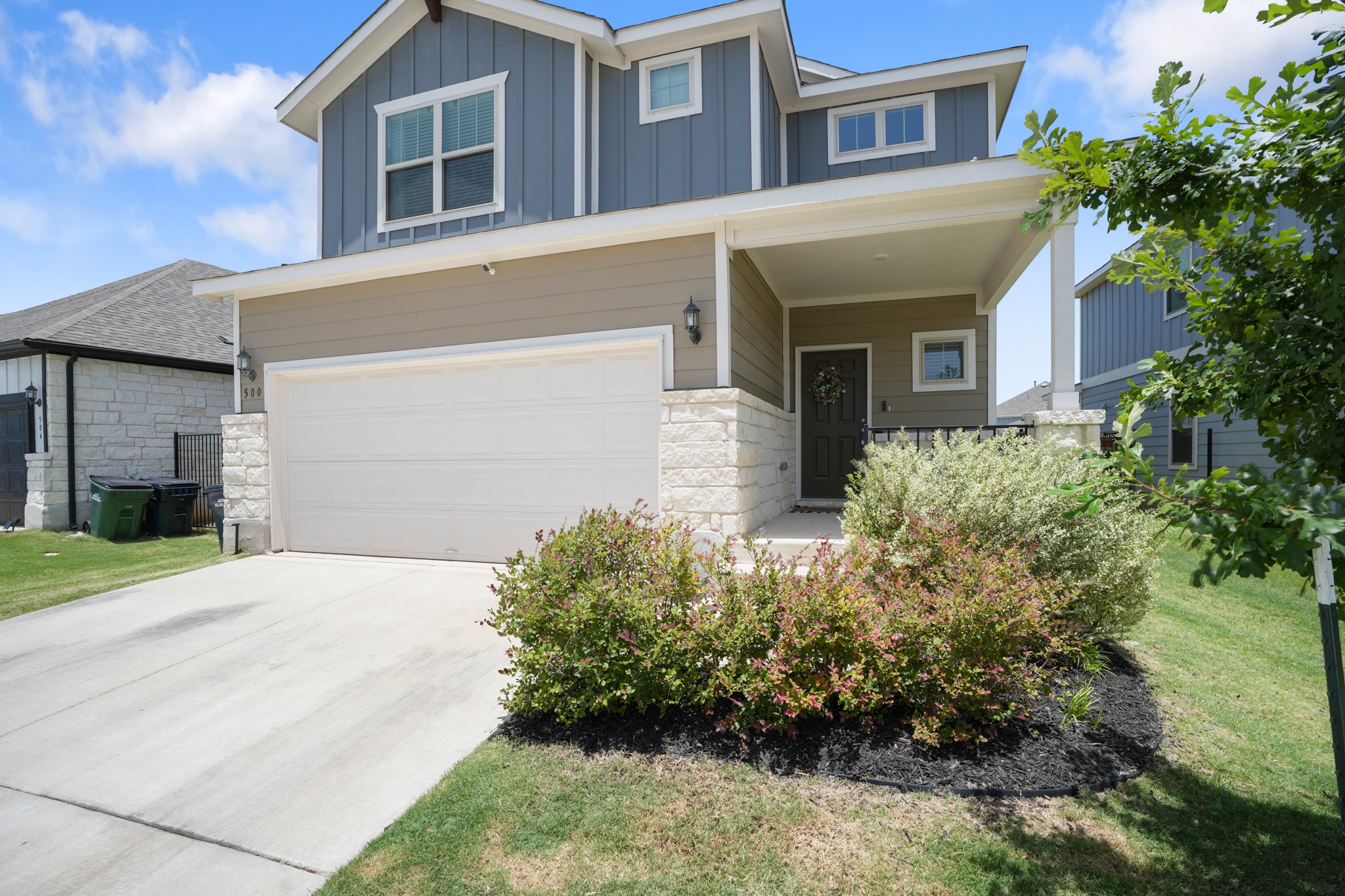 500 Pickrell Loop Georgetown, TX 78628 - Photo 2 of 29 a front view of a house with a yard and garage
