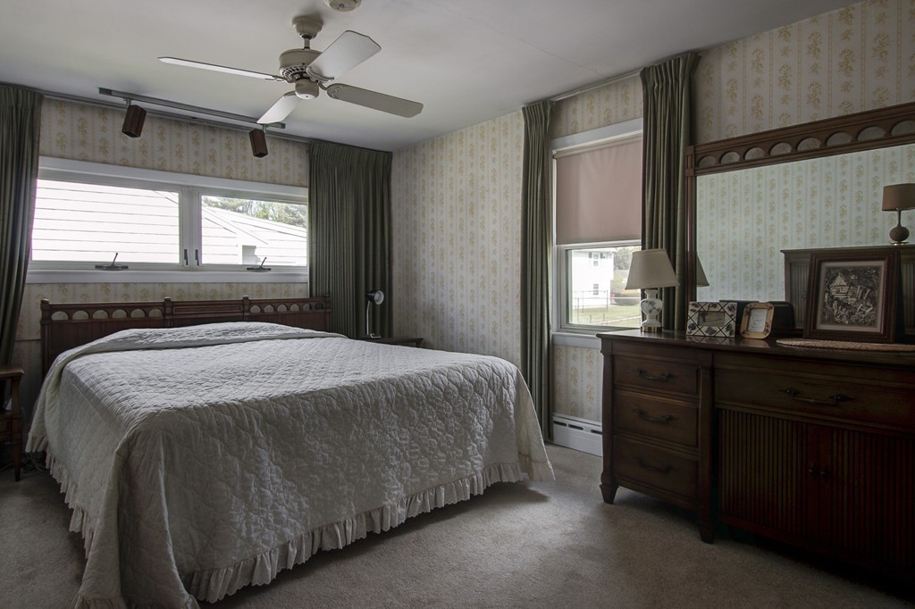 55 Tomahawk Road Arlington, MA 02474 - Photo 12 of 22 a bedroom with a bed and a dresser