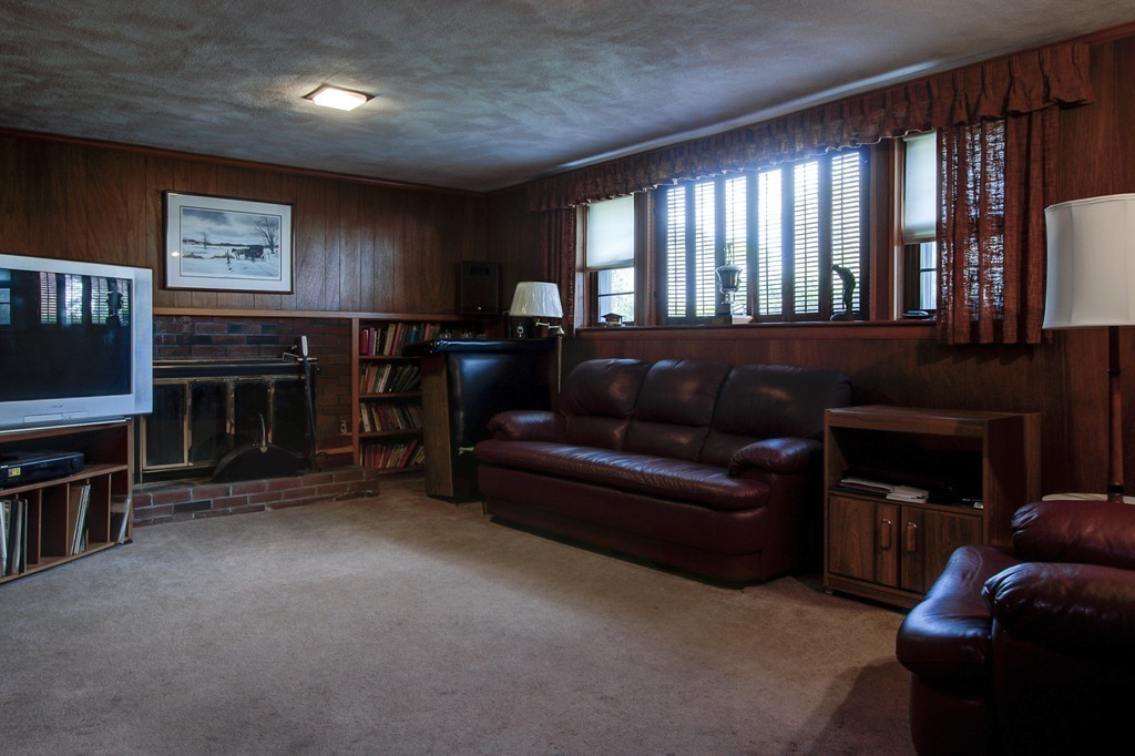 55 Tomahawk Road Arlington, MA 02474 - Photo 17 of 22 a living room with furniture and a flat screen tv
