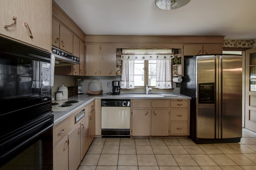 55 Tomahawk Road Arlington, MA 02474 - Photo 2 of 22 a kitchen with a sink stove and refrigerator
