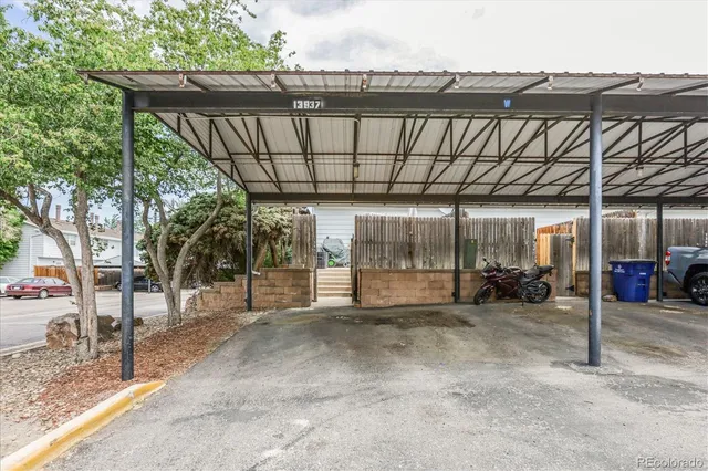 a view of a patio with a table and chairs
