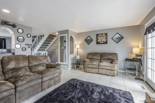 a living room with furniture and a couch