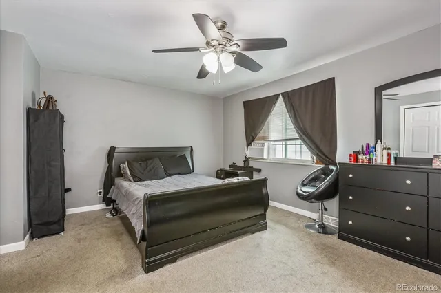 a bedroom with a bed and a dresser