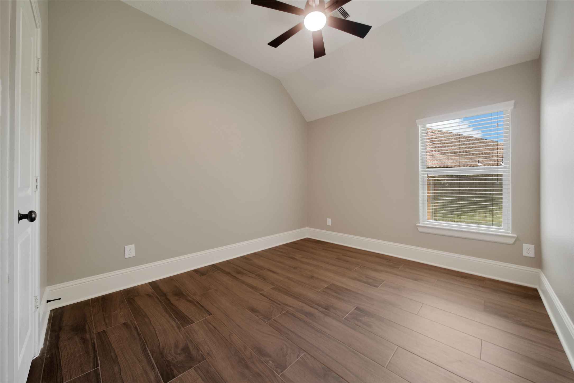 1215 Jake Springs Court Spring, TX 77386 - Photo 23 of 49 No carpet on the first floor! All bedrooms downstairs have the wood-look tile flooring.
