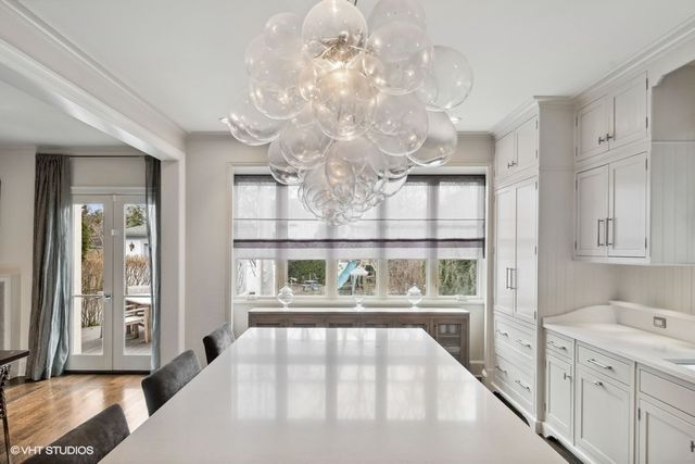 a kitchen with stainless steel appliances kitchen island granite countertop a sink and cabinets