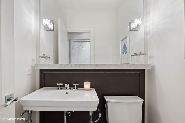 a bedroom with a bed and a fireplace