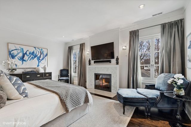 a bedroom with a bed couch and a window