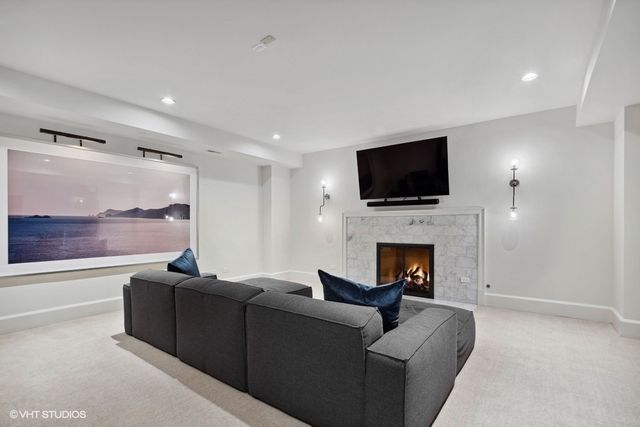 a room with furniture and a potted plant