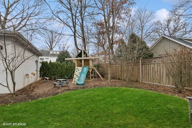 a picture of a bench in front of a wall