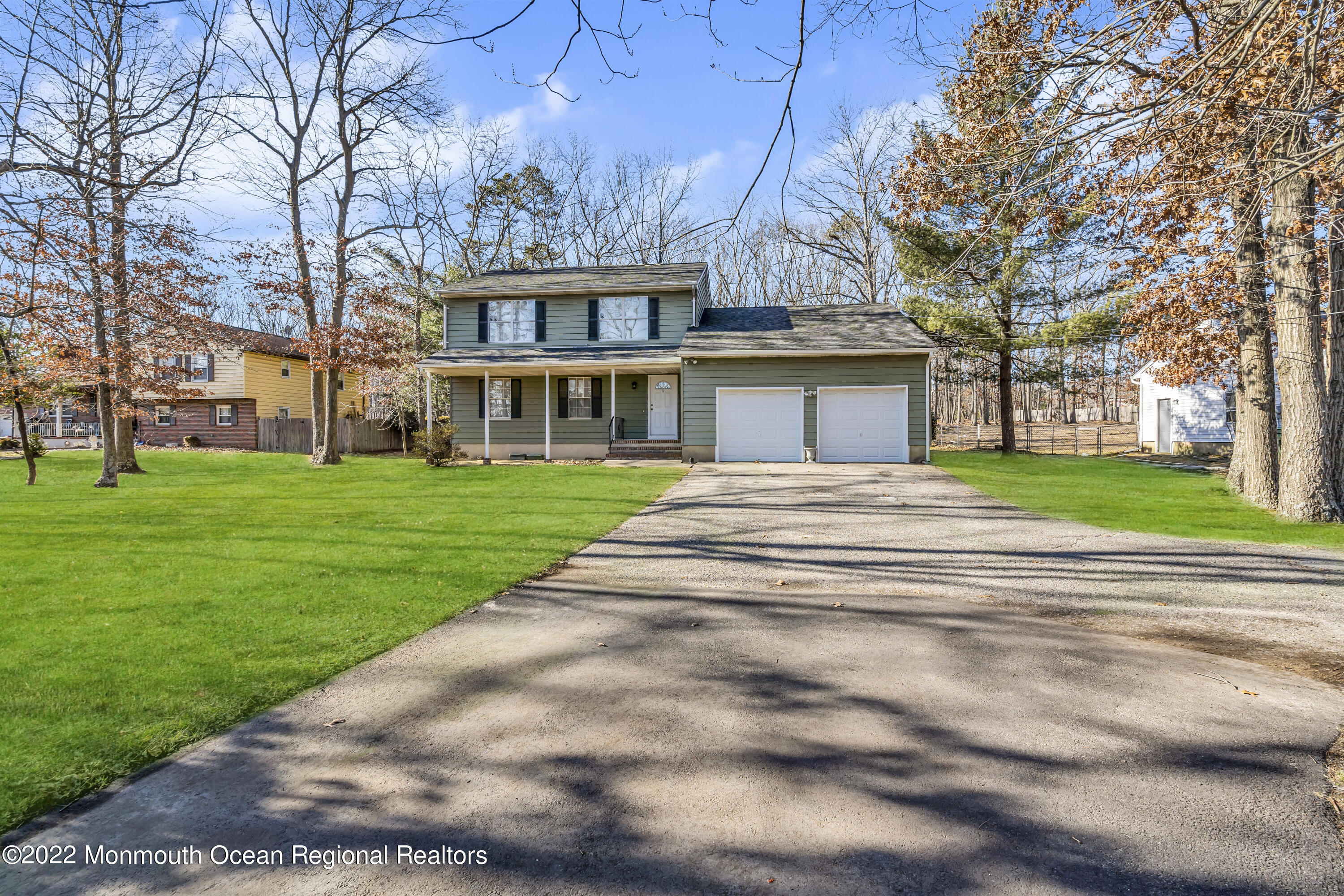 114 Hope Chapel Road Jackson, NJ 08527 - Photo 5 of 9 a front view of residential houses with yard and green space